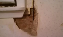 Repairing plastered exterior wall around a window