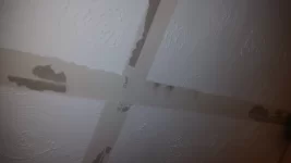 Plastering over failed artex