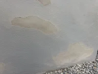 Bumps appeared in rendered retaining garden planter wall.