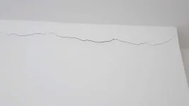New ceiling and cracks forming along edge of wall