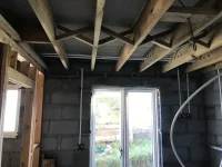 Plasterboard covering herringbone struts