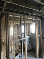 Plasterboard covering herringbone struts