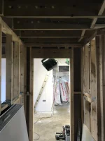 Plasterboard covering herringbone struts