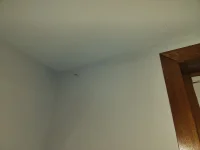 Small cracks top of wall just below ceiling