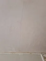 Newly skimmed Artex ceilings all showing long cracks (see pictures) - seeking advice on expectations/workmanship